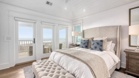 coastal bedroom with beach view from patio door