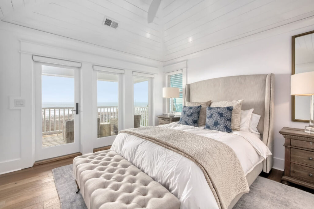 coastal bedroom with beach view from patio door