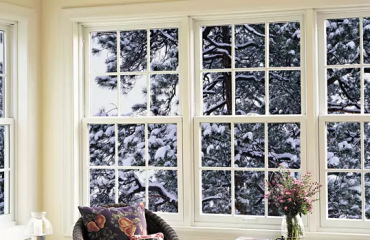 Windows with a snowy tree outside