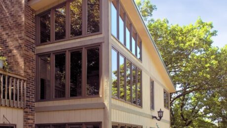 outdoor home with lots of glass windows