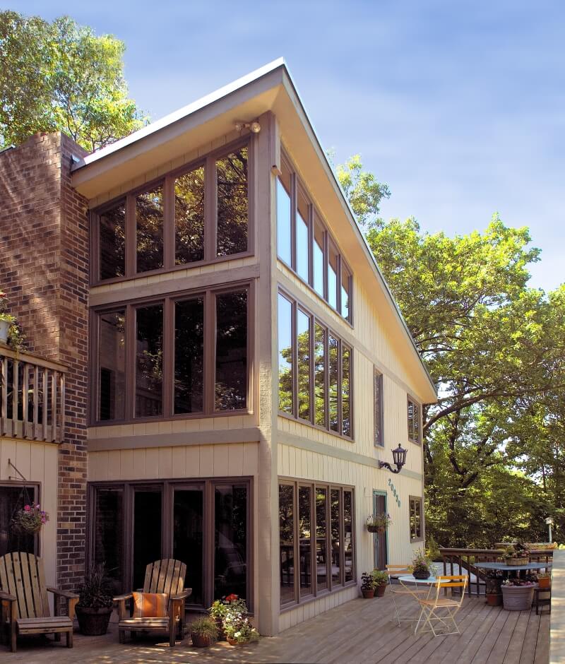 outdoor home with lots of glass windows