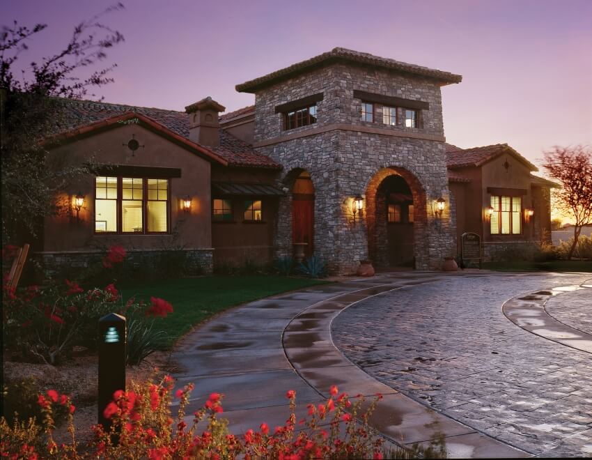 Outside of home at dusk with double-hung windows